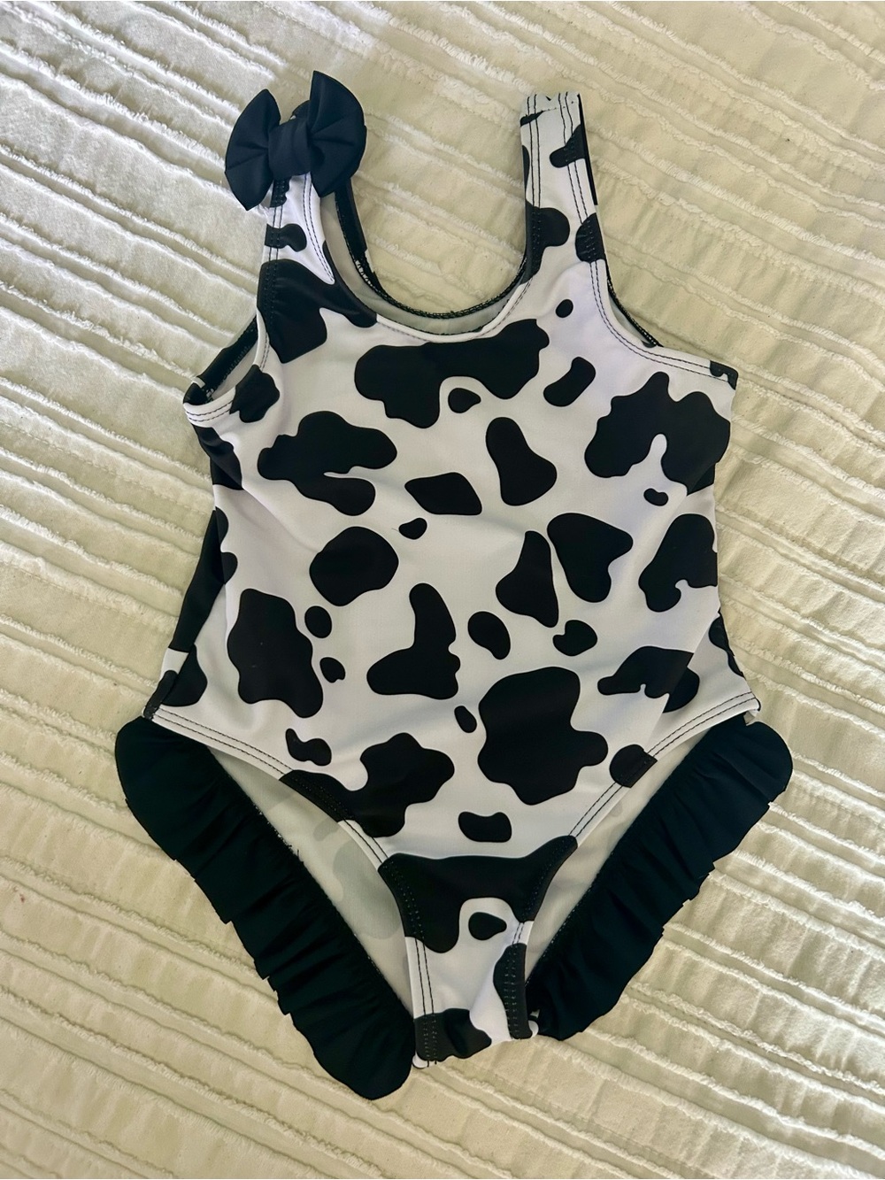 Black & White Cow Print Kids One-Piece Swimsuit with Bow